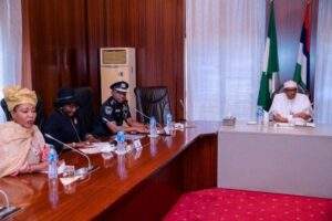 11757 Buhari with police and PSC member e1543254574255
