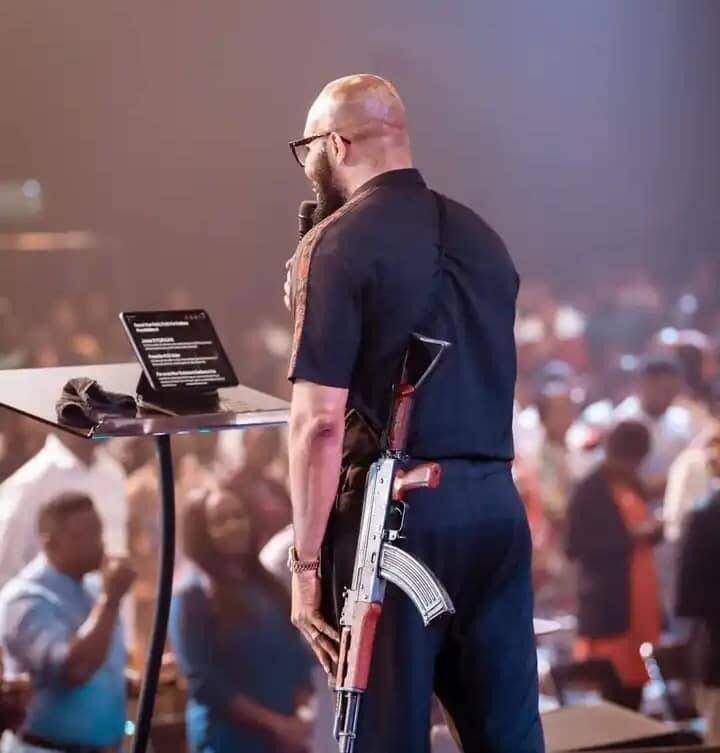 18775 our pastor held unloaded ak 47 rifle to illustrate his message church explains