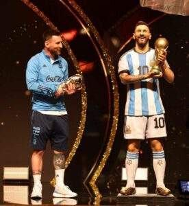 36537 messi honoured with baton of football statue