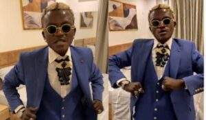 43553 im now a big man singer portable flaunts video of self donning suit for first time