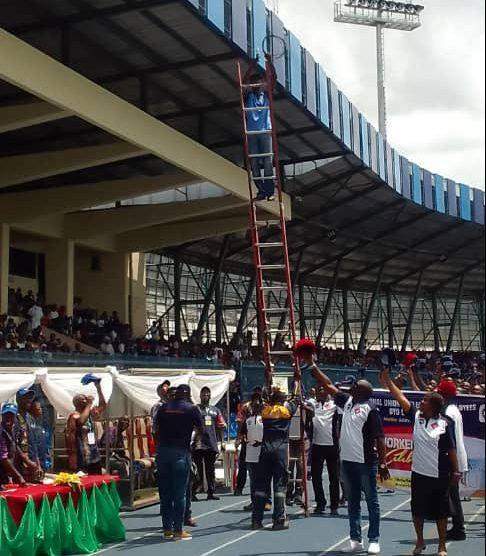 55438 may day electricity worker falls down ladder during match past in ibadan