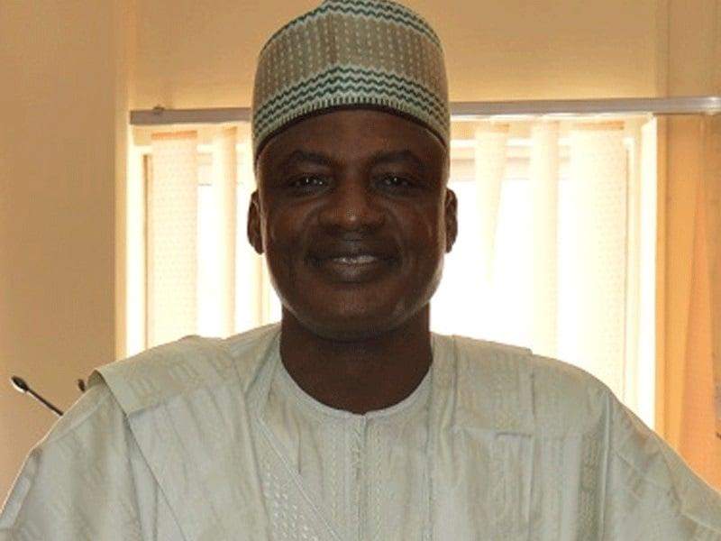 56903 buhari salutes ex dg national sports commission al hassan yakmut at 62
