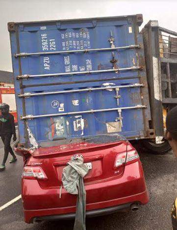 61622 driver miraculously survives as 40ft container crushes car in lagos
