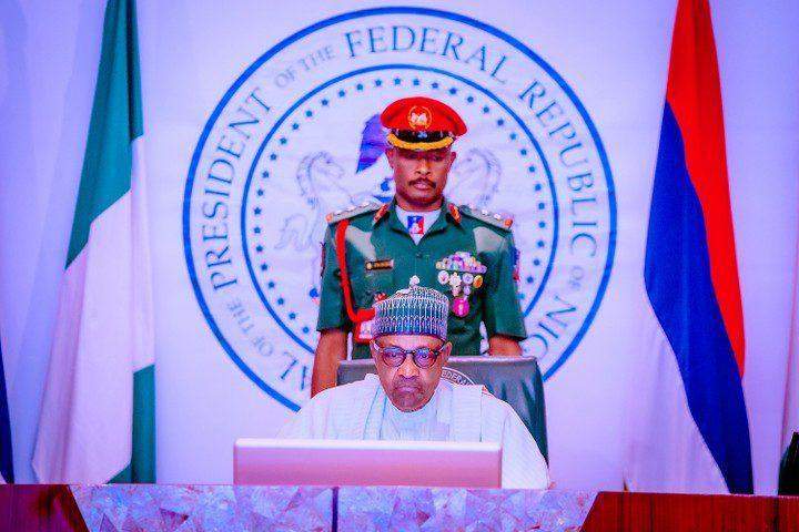 65787 president buhari swears in seven rmafc commissioners