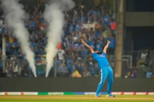 Mohammed Shami celebrates the wicket of Daryl Mitchell