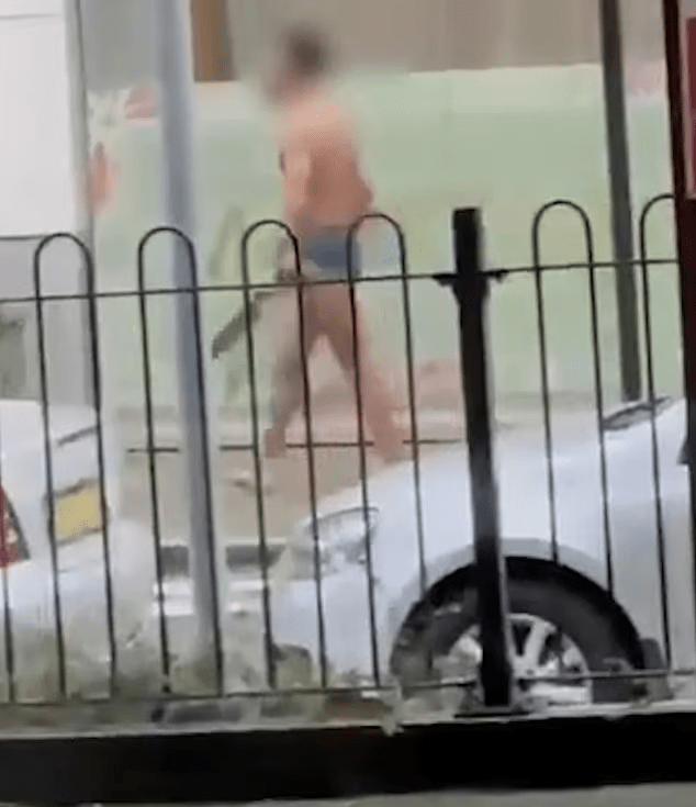 man with large knife naked