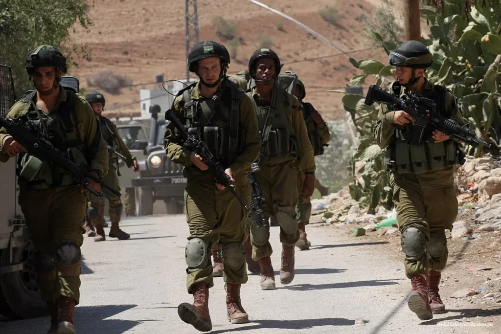 FILE PHOTO Israeli military patrol the streets