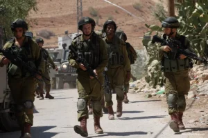 FILE PHOTO Israeli military patrol the streets