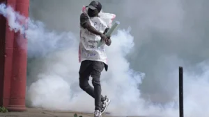 A Protester Returns Back A Teargas Canister To Kenya Police In Nairobi Kenya Thursday June 27 2024 300x169