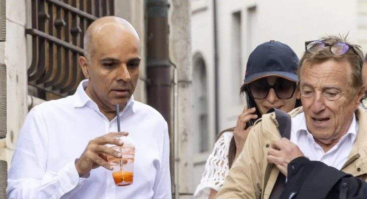 ajay hinduja l and his wife namrata arrive with their lawyer robert assael