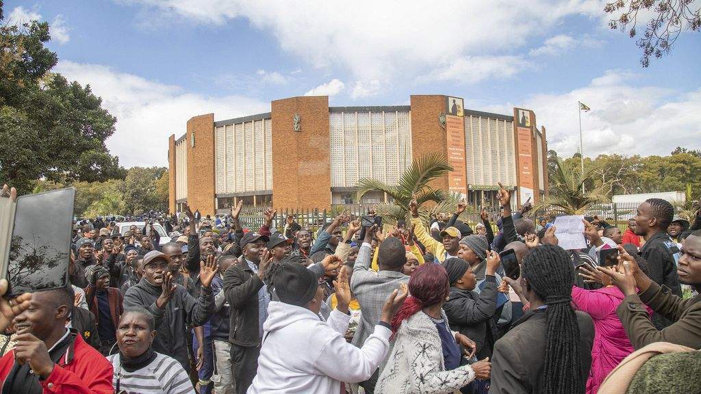 Opposition supporters demonstrate outside a court in Harare, Zimbabwe, on June 27, 2024