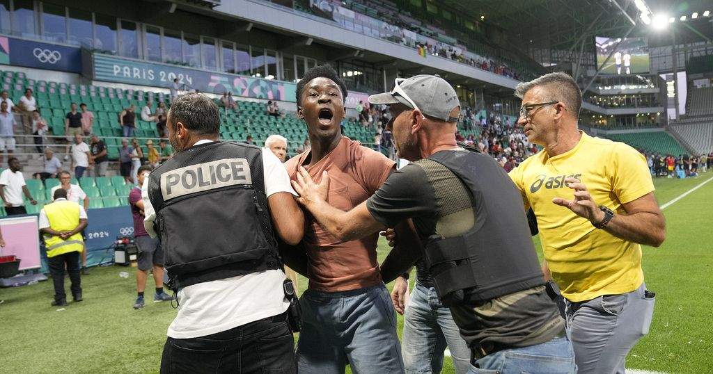 Olympic Football Tournament Marred by Fan's Pitch Invasion