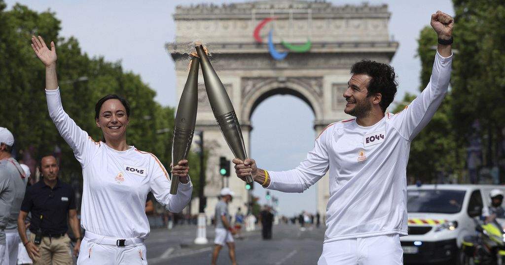 Olympic Torch Arrives in Paris for Bastille Day and Olympic