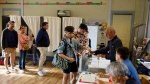 a woman casts her ballot in the second round of the legislative elections july 7 2024 in rennes western france