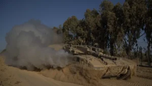 israeli soldiers move on the top of a tank near the israeli gaza border monday july 8 2024
