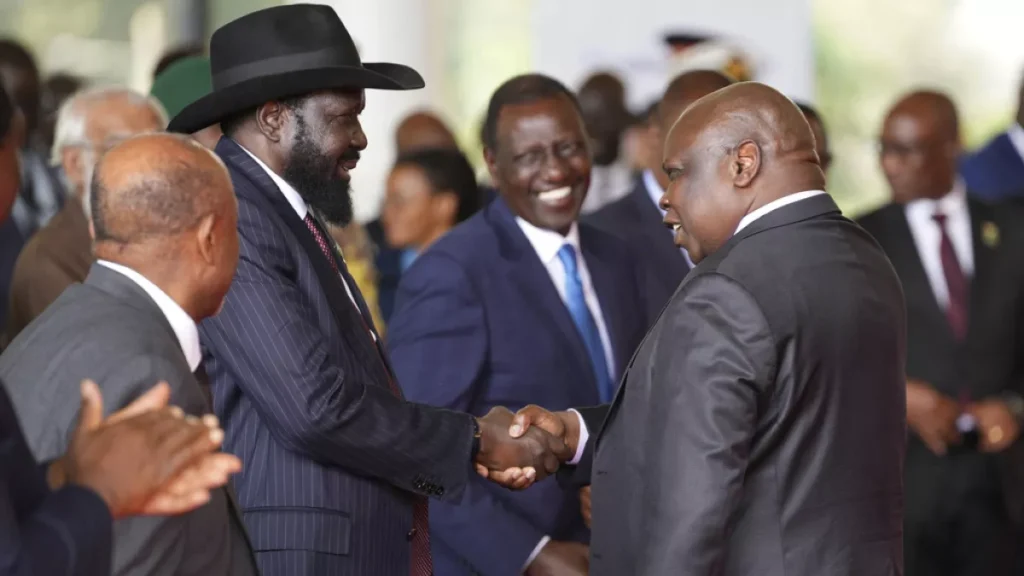 south sudanese president salva kiir mayardit left shakes hands with pagan amum