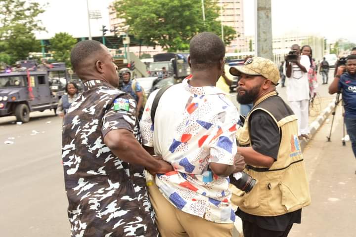 FCT Police Clash with Protesters, Fire Teargas, Arrest Journalists and