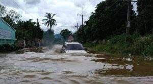 Coach Stuck on Roof Amid Flash Floods, Draws on Cave