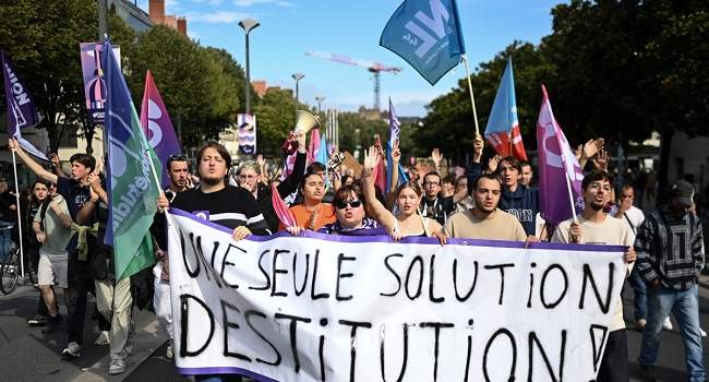 Tens of thousands protest Macron's 'power grab' in France