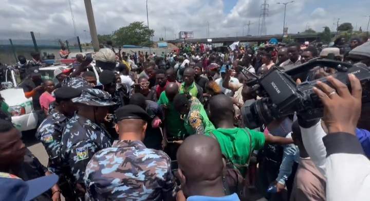 Police Hand Out Water to Protesters on Independence Day