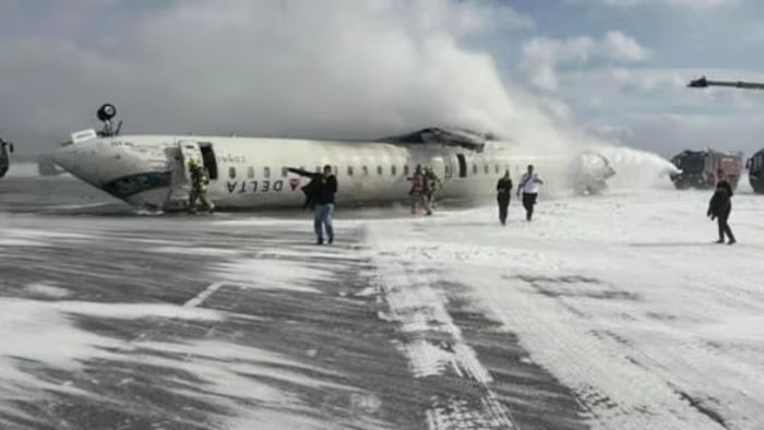 Delta plane flips over while landing in Toronto airport, eight injured