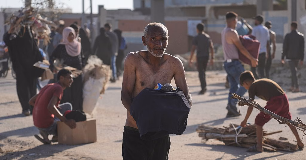Chaos erupts as Palestinians pick up aid at a distribution center in Rafah