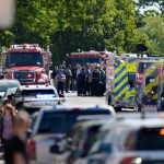 Law enforcement officers gather outside the Annunciation Church's school in response to a reported mass shooting, Aug. 27, 2025, in Minneapolis. Abbie Parr/AP