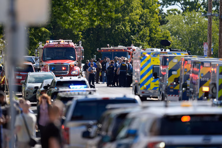 Law enforcement officers gather outside the Annunciation Church's school in response to a reported mass shooting, Aug. 27, 2025, in Minneapolis. Abbie Parr/AP