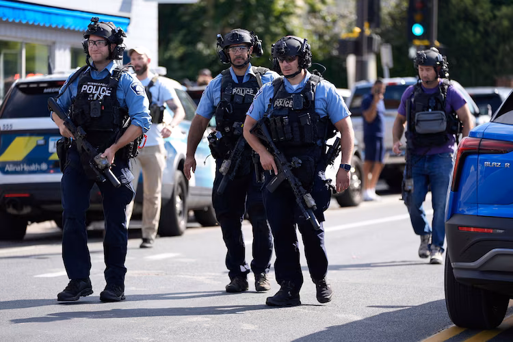 Police and first responders work at the scene of a shooting near Annunciation Church and Catholic School in Minneapolis, Minneosta, on August 27, 2025.