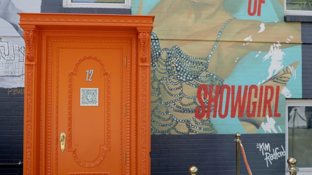 Did Taylor Swift use AI art? 'Life of a Showgirl' orange door videos seem AI-generated
