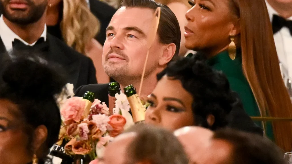 Leonardo DiCaprio's animated Golden Globes side conversation is the night's biggest mystery