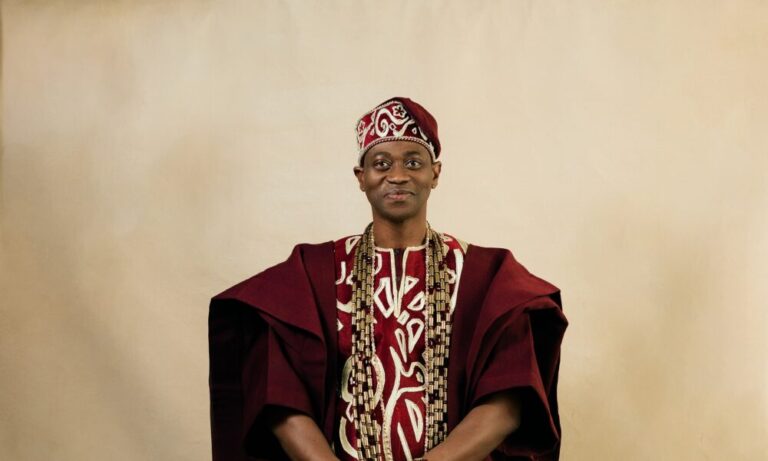 Lateef Adedimeji’s Wine Agbada Look Is Everything We Love About Nigerian Menswear