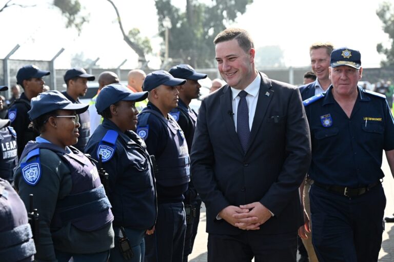 Cape Town Mayor Geordin Hill-Lewis with members of law enforcement during the announcement of a formal inter-governmental dispute over the devolution of policing powers to Metro Police on 03 August 2026.