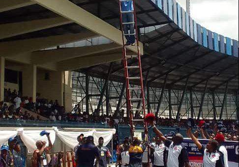 55438 may day electricity worker falls down ladder during match past in ibadan