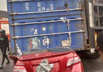 61622 driver miraculously survives as 40ft container crushes car in lagos