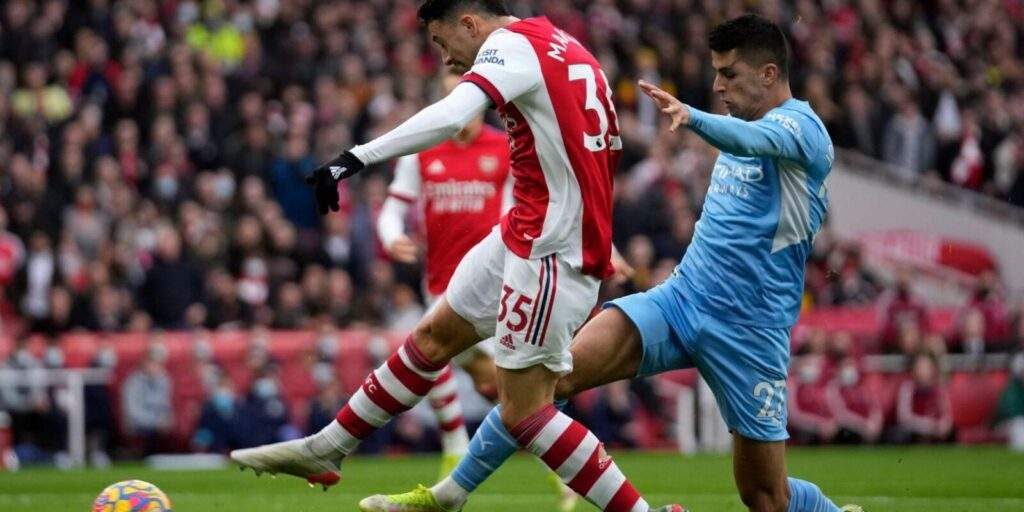 67521 record breaking earnings for man city and arsenal as they finish top two in epl