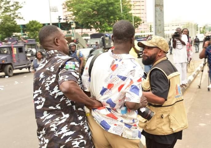 FCT Police Clash with Protesters, Fire Teargas, Arrest Journalists and