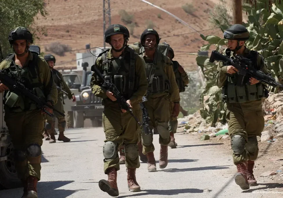 FILE PHOTO Israeli military patrol the streets FILE PHOTO Israeli military patrol the streets