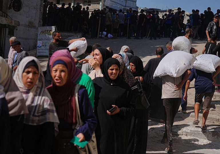 Gaza residents welcome rare organized aid delivery after months of chaos and hunger