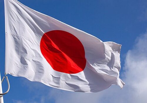 Japan-flag-waving-in-the-wind-against-blue-sky_2.jpg