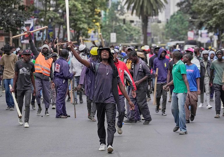 Kenyan Police Shoot Bystander Amid Protests Over Blogger's Death in Police shoot man at close range during Kenyan protests