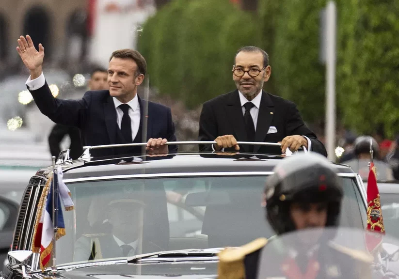 Morocco's king Mohammed VI, right, and French president Emmanuel Macron wave to crowds during the latter's official visit to Morocco Morocco's king Mohammed VI, right, and French president Emmanuel Macron wave to crowds during the latter's official visit to Morocco