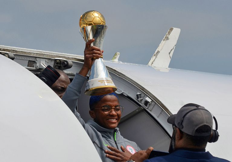 Nigeria’s women’s football team receives hero’s welcome after winning continental title