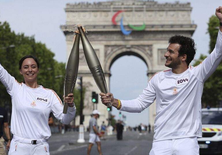 Olympic Torch Arrives in Paris for Bastille Day and Olympic Olympic Torch Arrives in Paris for Bastille Day and Olympic