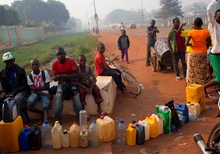 People queuing to buy fuel at a service station in Bangui Central African Republic