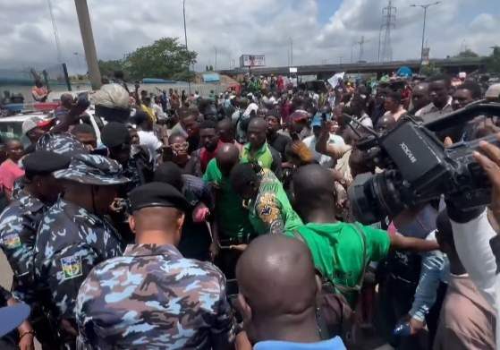 Police Hand Out Water to Protesters on Independence Day Police Hand Out Water to Protesters on Independence Day