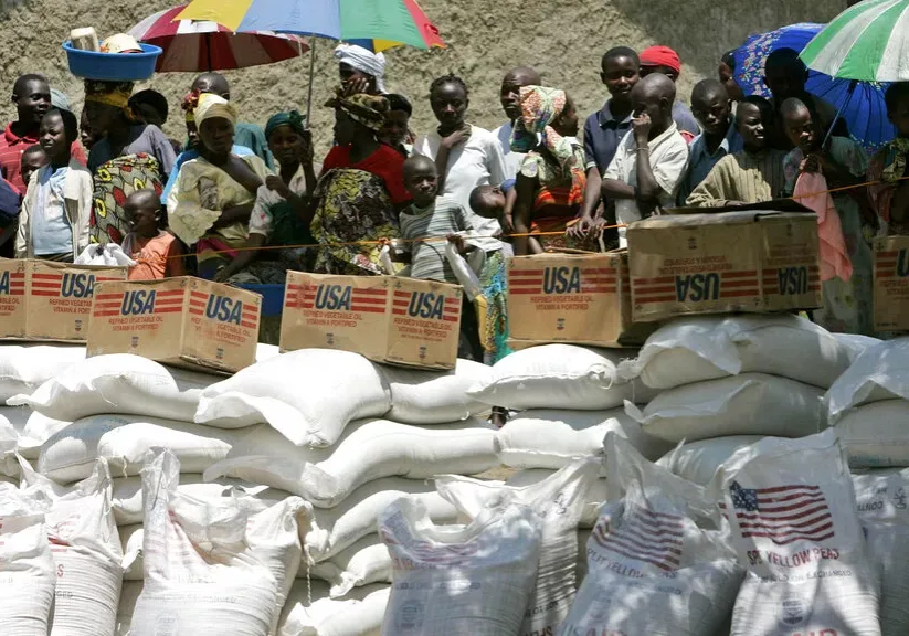 displaced people wait their turn to receive food aid from the world food program displaced people wait their turn to receive food aid from the world food program