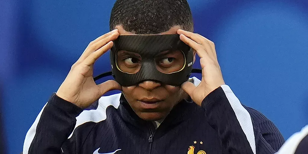 kylian mbappe of france adjusts his face mask kylian mbappe of france adjusts his face mask