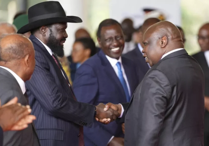 south sudanese president salva kiir mayardit left shakes hands with pagan amum south sudanese president salva kiir mayardit left shakes hands with pagan amum
