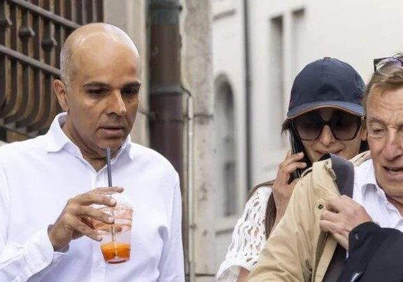 ajay hinduja l and his wife namrata arrive with their lawyer robert assael